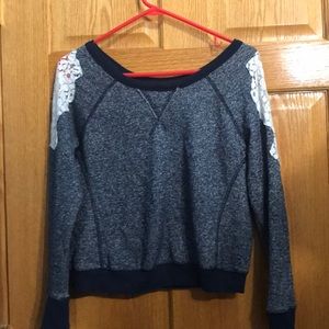 Blue sweater with white lace on the shoulders